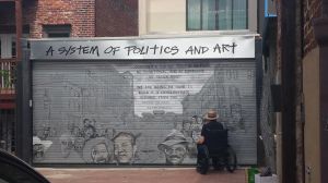 An artist at work in Blagden Alley in D.C.