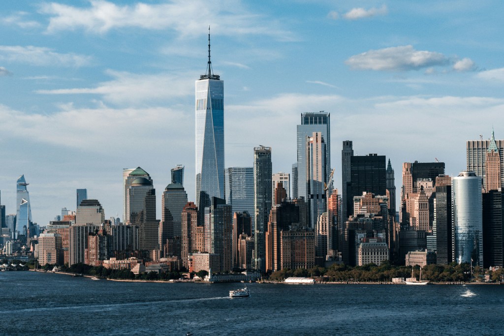 A picture of the NYC skyline as seen from the water looking at Lower Manhattan